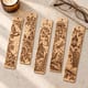 Five engraved bookmarks with a bird, rose, mushroom, dragonfly and lantern