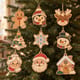 Painted Christmas ornament set hanging on a Christmas tree