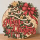 Painted round Merry Christmas sign with a ribbon-wrapped tree and big bow standing on a wooden table
