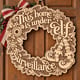 Unpainted wooden This Home Is Under Elf Surveillance wreath hanging on a front door