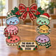 Painted kawaii dumpling Christmas wreath standing on a wooden table