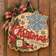 Painted round Christmas Countdown sign with a large snowflake hanging on a wooden front door