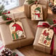 Painted gnome, snowman and ho ho ho gift tags on wrapped presents