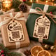 Close-up of engraved Santa Tracker tags on two wrapped gifts